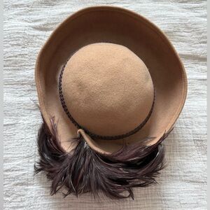 Vintage wool hat with feathers.